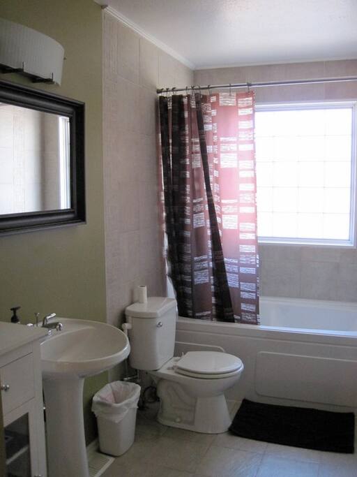The main bathroom comes equipped with a large tub, perfect for soaking in!