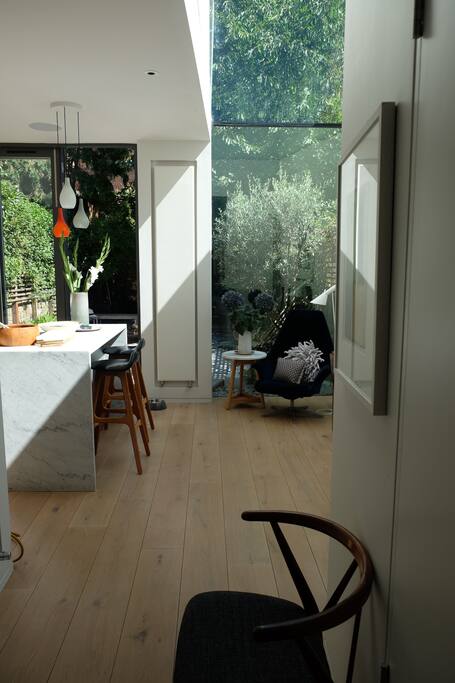 Looking into the kitchen/ dining area and the open space beyond