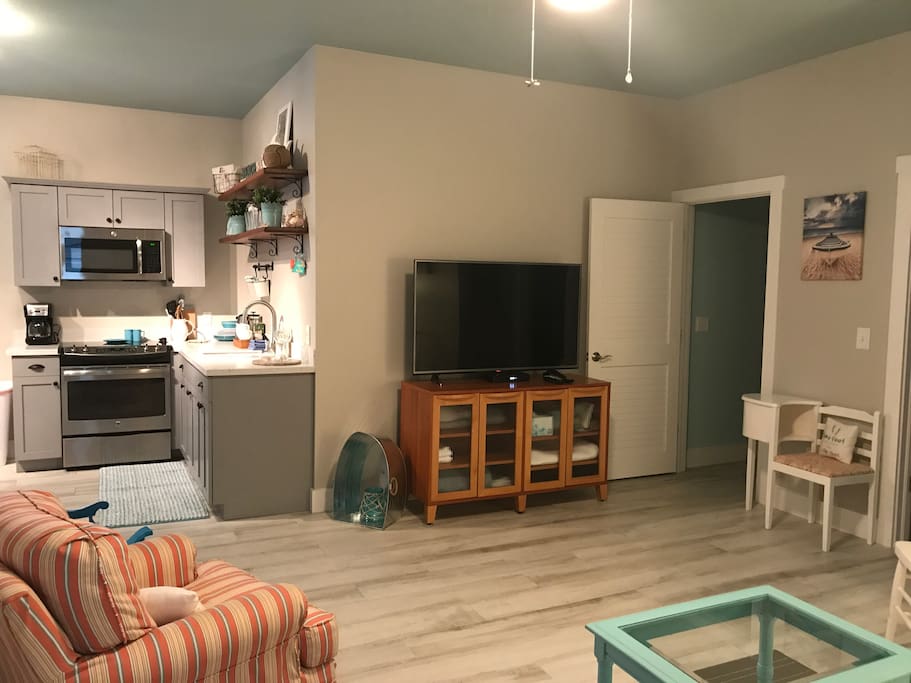 Large Open Living space with eat in Kitchen, large television and extra seating for visiting guests. Cabinet full of extra towels, blankets, pillows too!