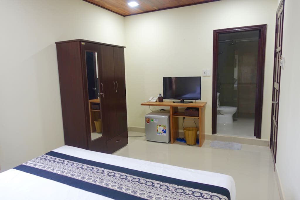 Wardrobe, TV, mini fridge