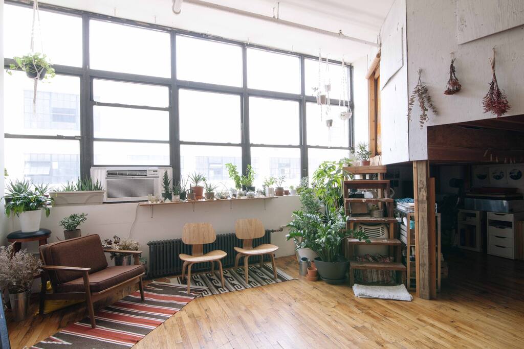 Our light-filled, handmade tree house loft. The stairs lead you to the tree house room.