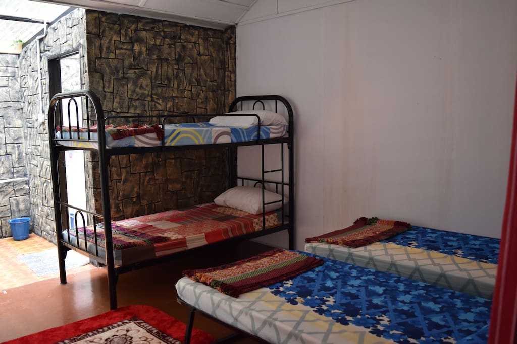 Each Tudor Pond room has 2 single, 1 set of bunk beds, wall fan and own bathroom.