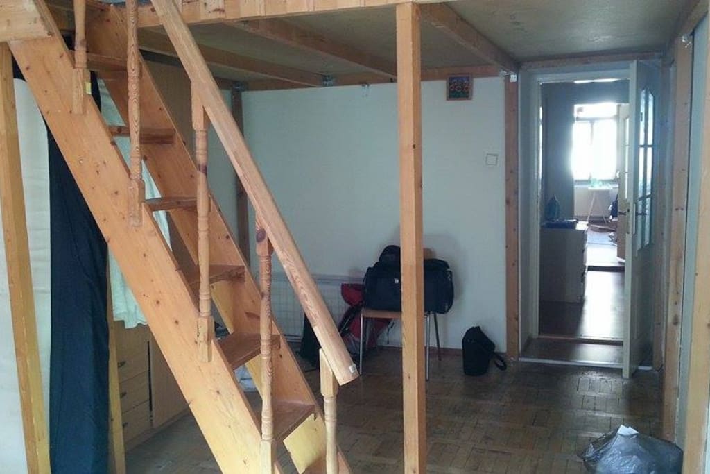 Wardrobe and open space under the loft.