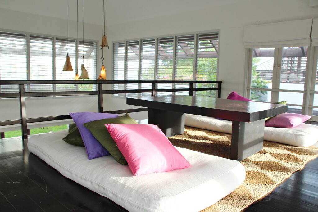 Loft with coffee table and floor cushions
