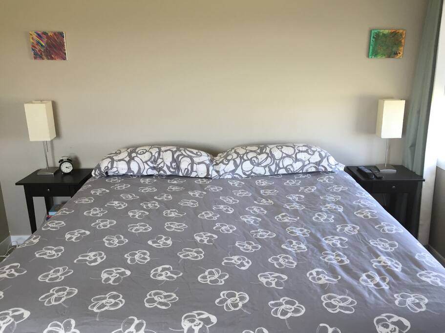 King size bed in master bedroom, with ensuite full bathroom that has a TV/cable/dvd player
