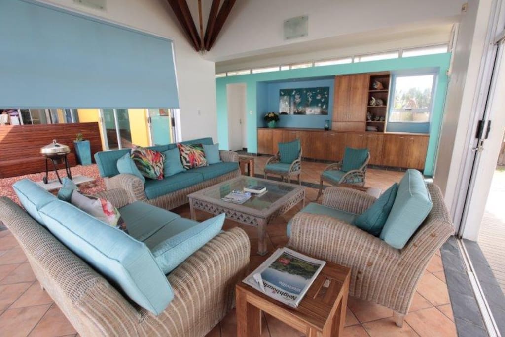 Light, sunny lounge opening to pool and sea