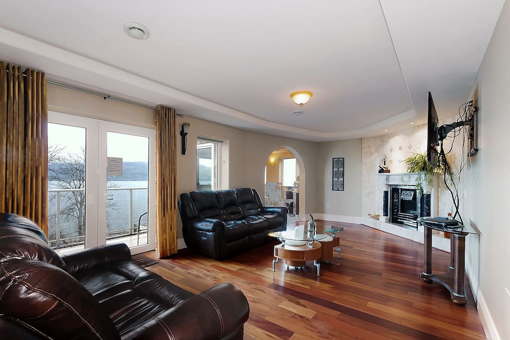 Presidential Master Bedroom sitting area , french door let to private lake view balcony.