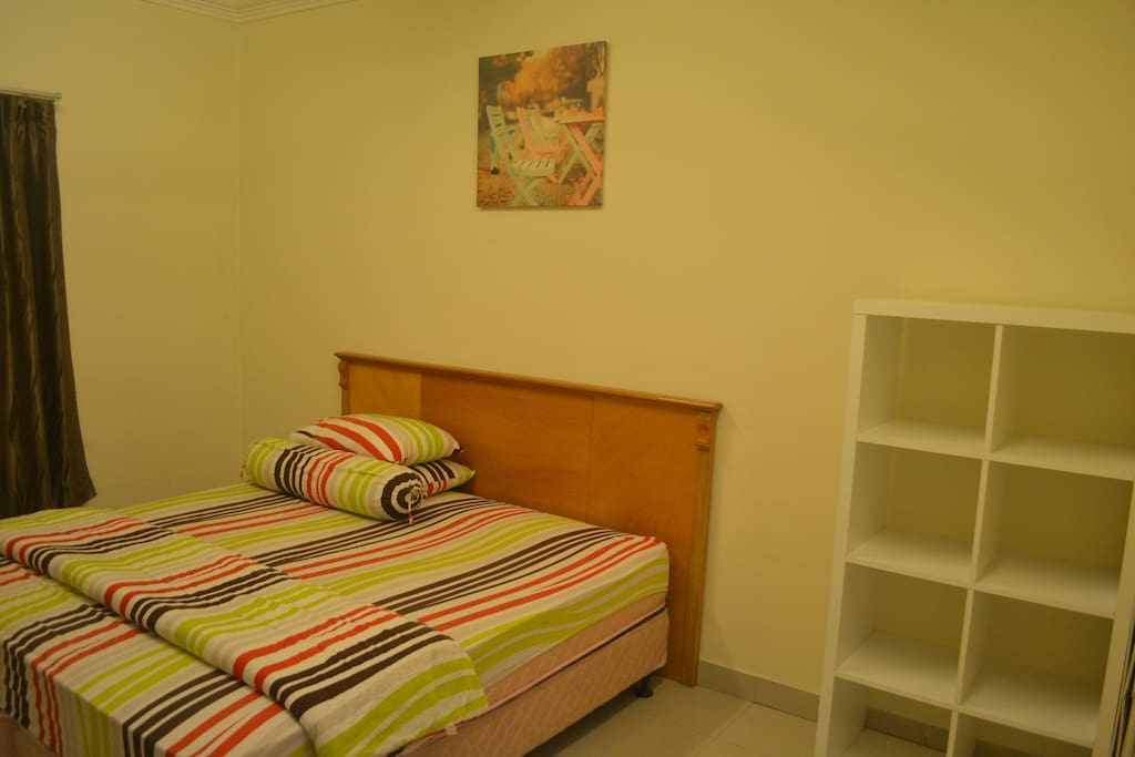 Cozy king size bed that can fit 2 to 3 persons.
