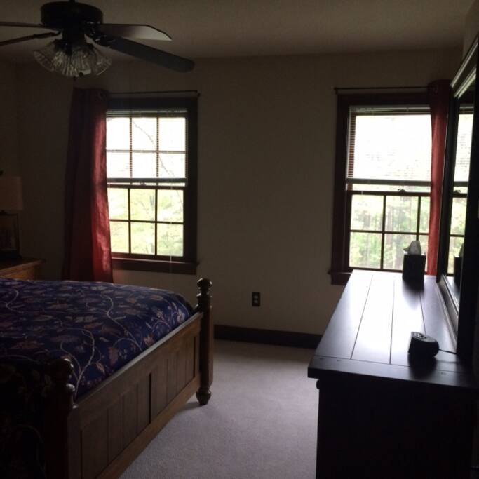 There is a beautiful view out those sunny windows!