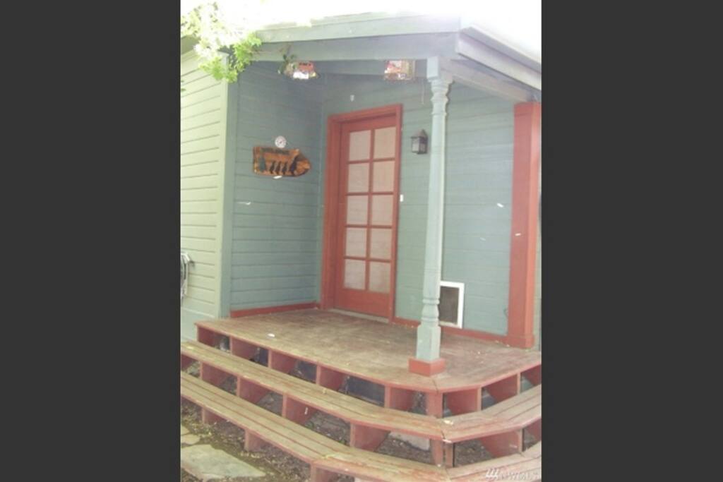 Back porch leading to flagstone patio