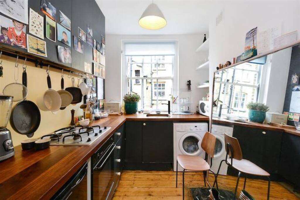 Kitchen with everything you need, oven, washer-dryer, microwave, stove, fridge