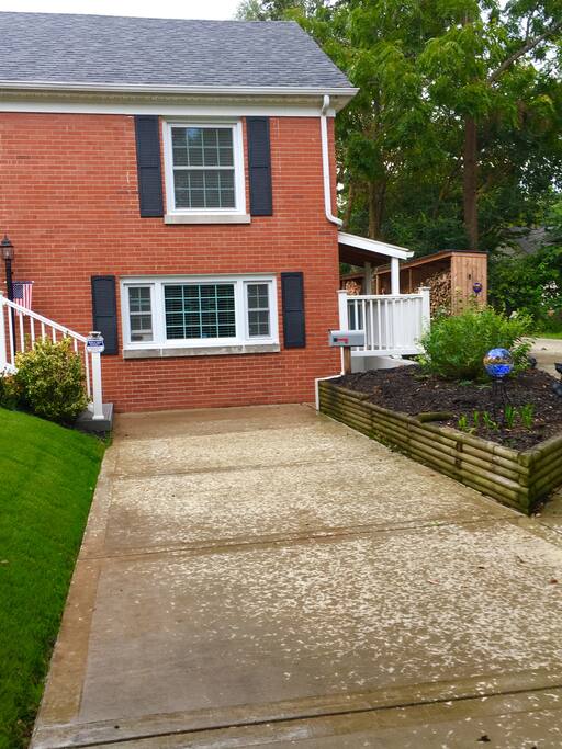 Private entrance to the right of the driveway.