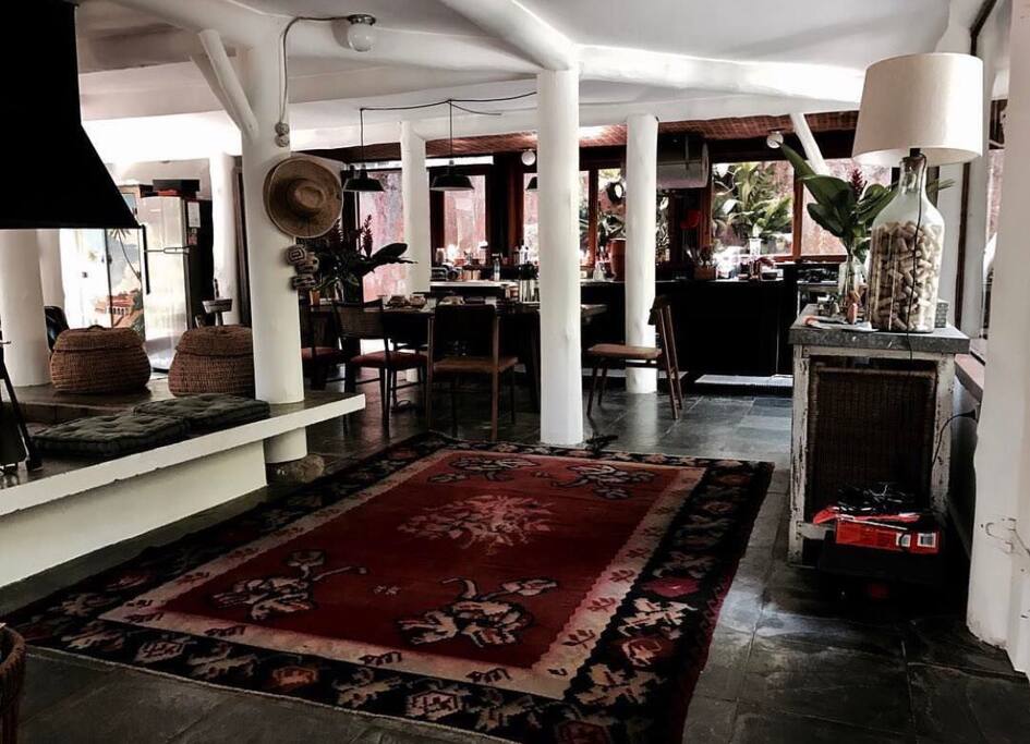 Living room with a central fireplace.