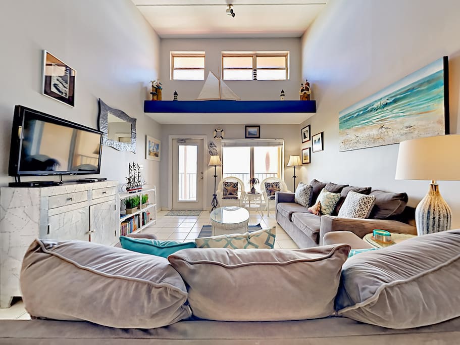 Enjoy lots of natural light in the beach-inspired living room.