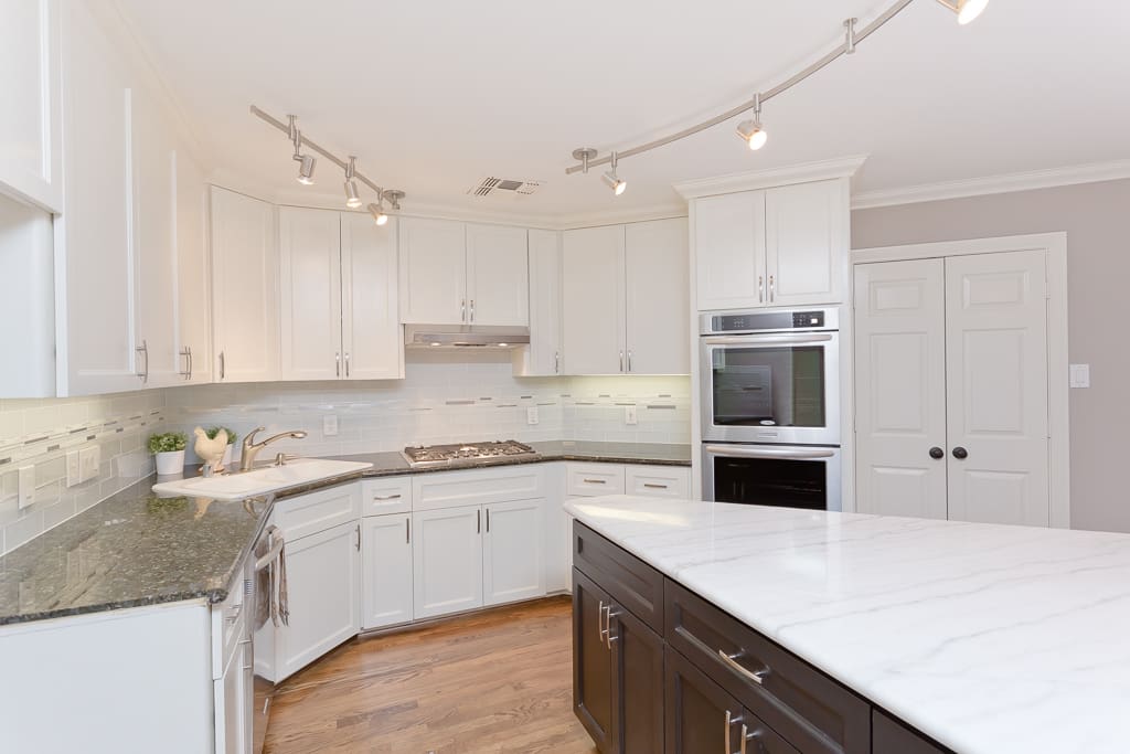 Carerra marble and granite countertops. Brand new appliances and French door refrigerator.