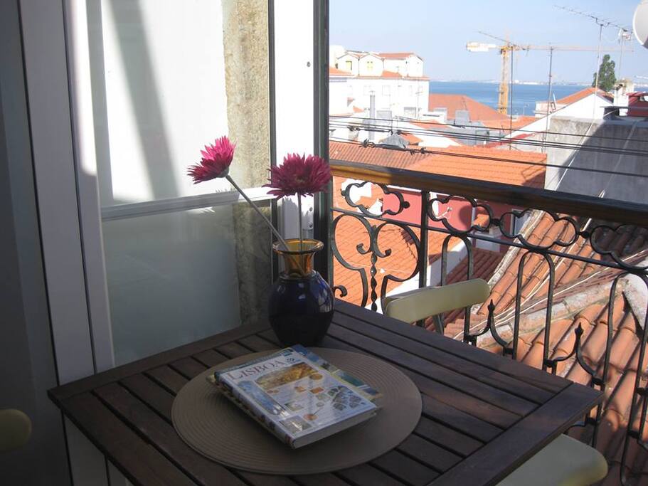 View over the house of Alfama with the Tagus River right there