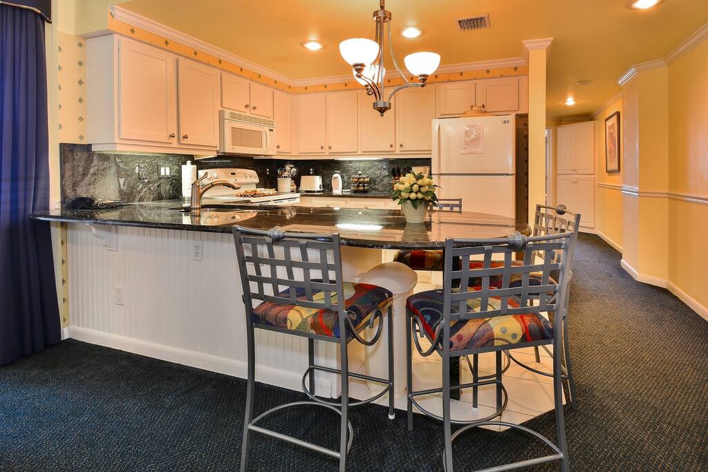 Kitchen with Large Granite counter Eating Area