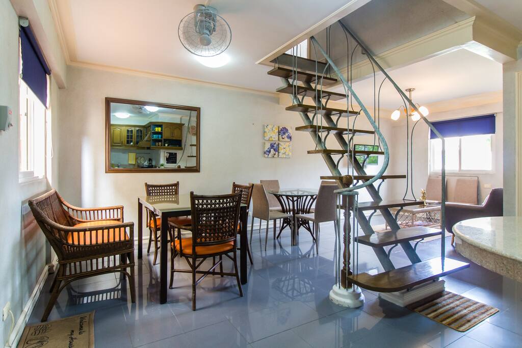 Dining area with a window facing the building corridor.