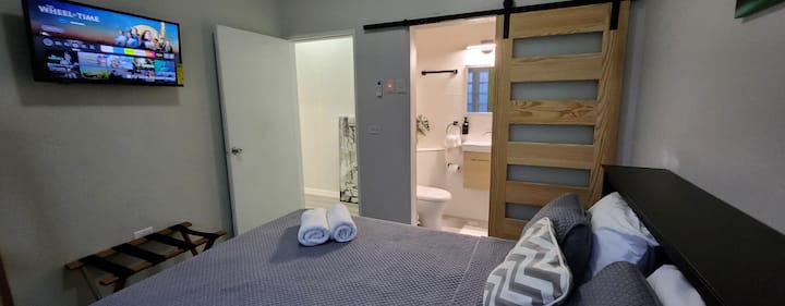 The secondary bedroom features an ensuite full bath (compact but functional!)
