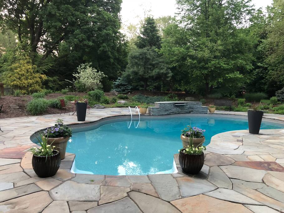 Heated saltwater pool with waterfall and diving board
