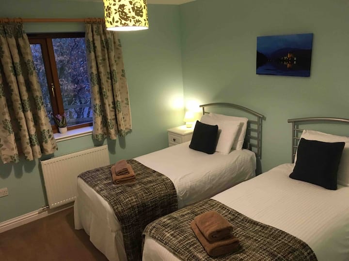 Bedroom 3 with twin beds and fitted wardrobe