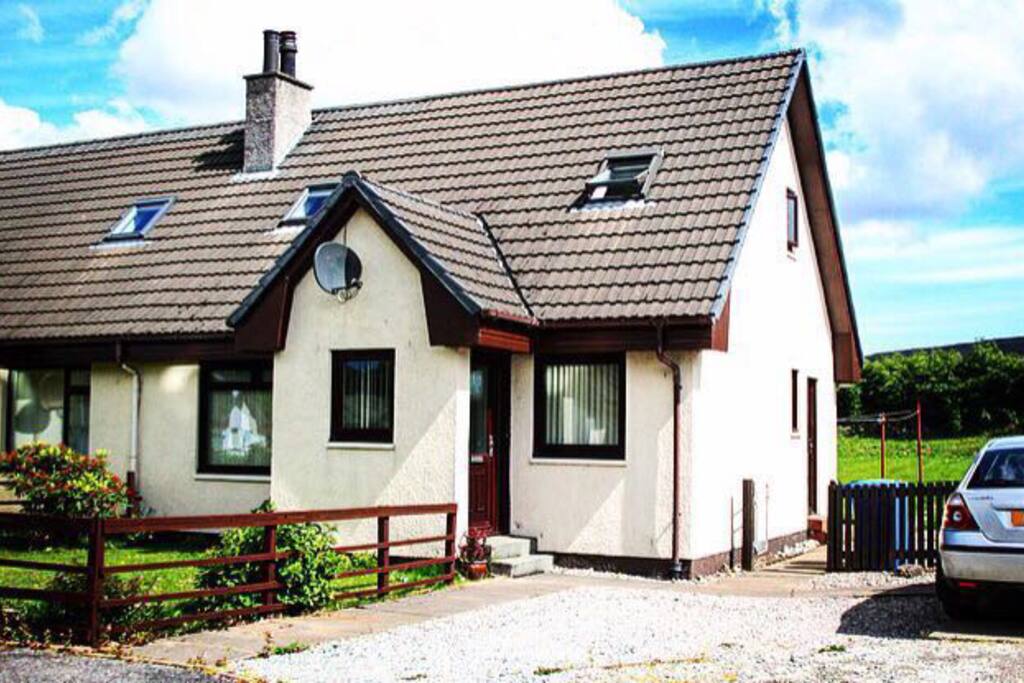Front of house with parking for two cars