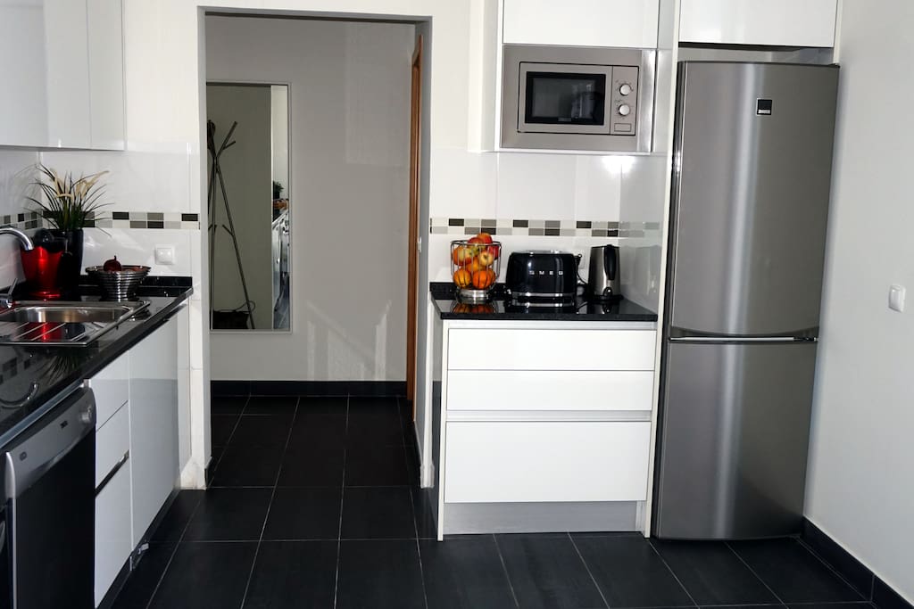KITCHEN MODERN & SPACIOUS LEADS TO BARBEQUE PATIO