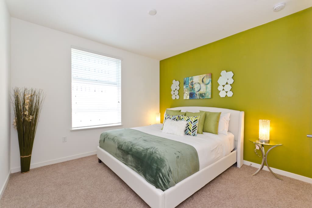Master bedroom with a king size bed with pillow top mattress and 1500 thread count sheets