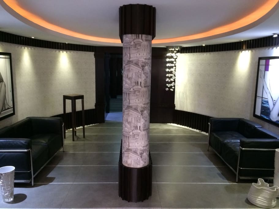 Modern and Luxurious decor al around. Entrance to the building and access to elevator.