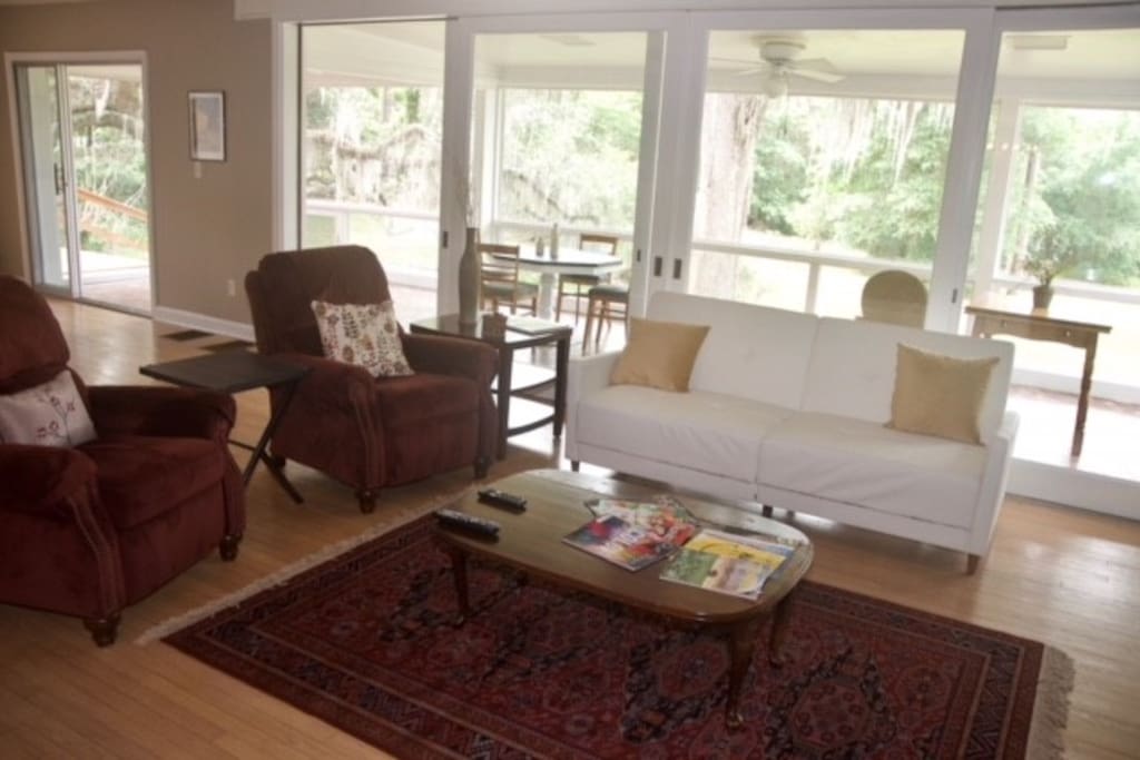 living room with large enclosed lanai behind