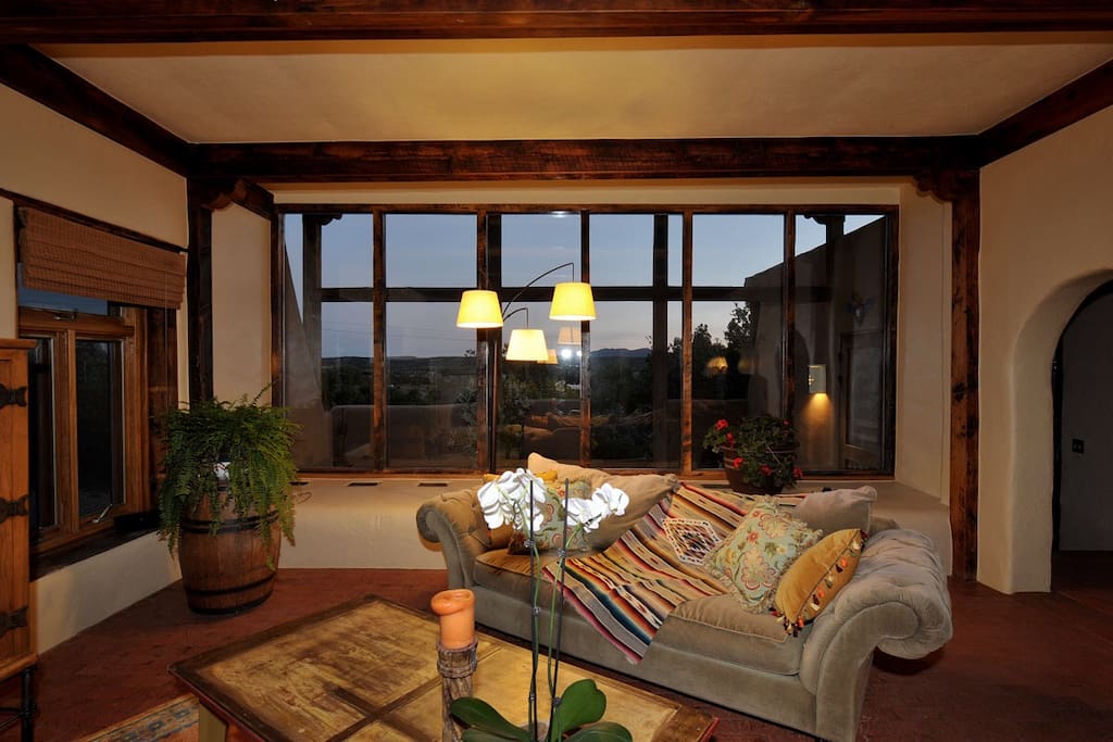 Cozy, tastefully decorated living room is the perfect place to relax in front of an inviting fire