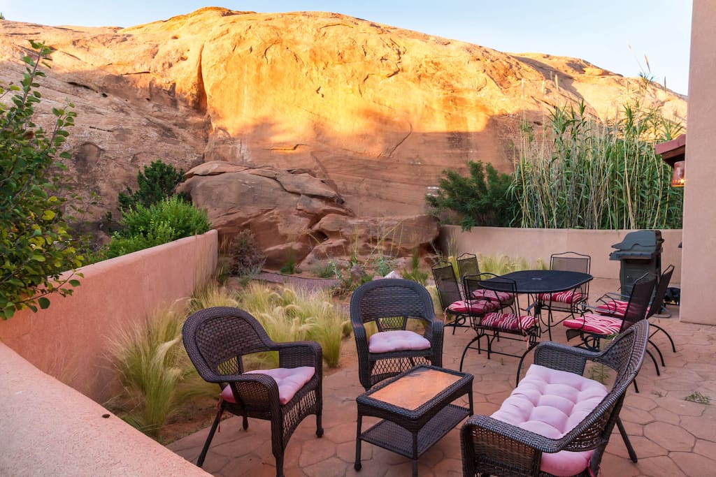 Lots of outdoor seating on the patio, nestled against one of Moab's famous rock fins!