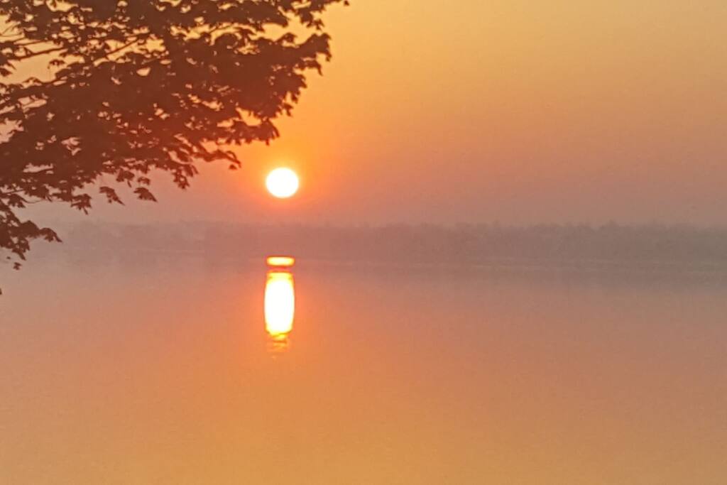 Sunrise over misty lake