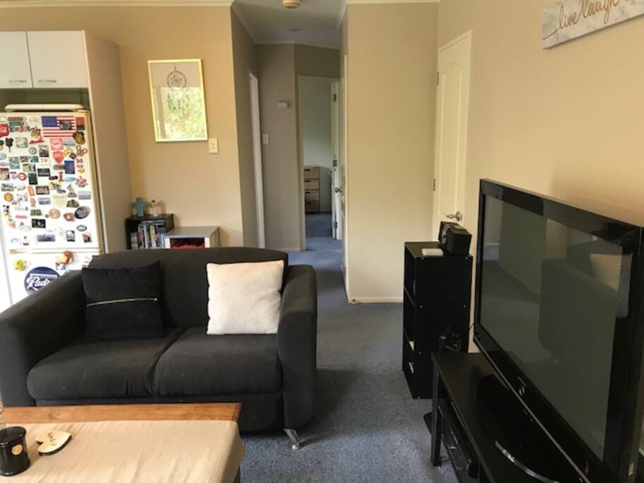 Lounge, 42” tv with Sky TV, hallway leading to bedrooms and bathroom