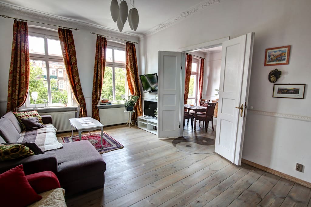 Classic living in a historical building. High ceilings, wooden floors and original wooden stucco.