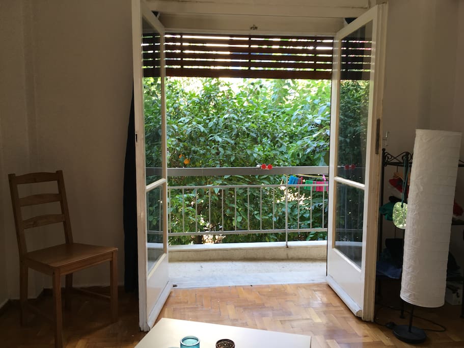 View to the balcony and courtyard from bed
