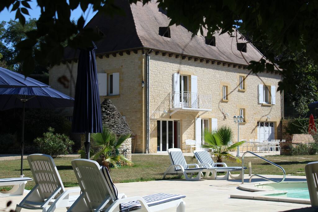 View from the shady pool bar area to the house