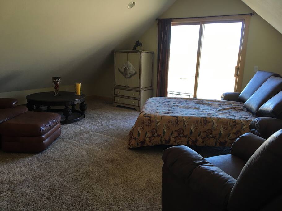 Adjourning room with furniture and couch that can turn into sleeper sofa