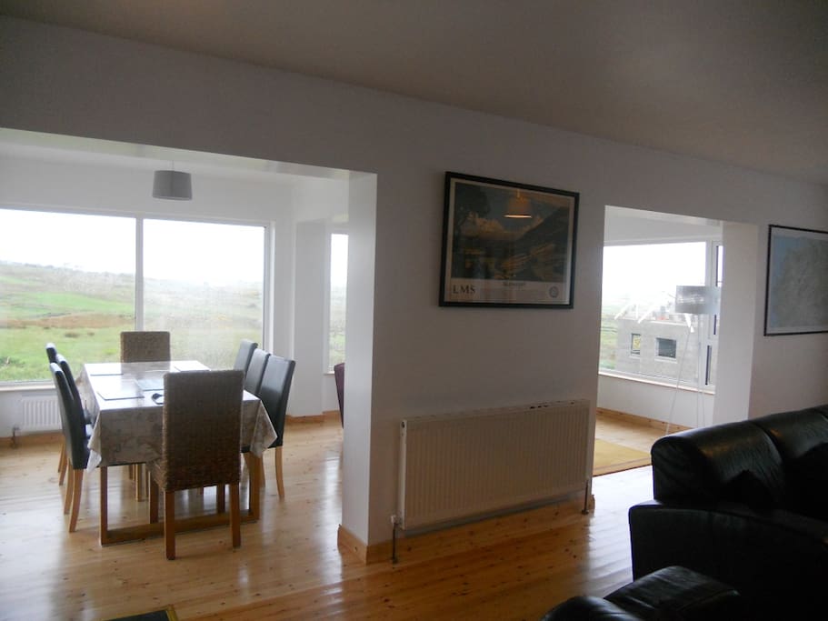 Open plan view from kitchen area into sunroom