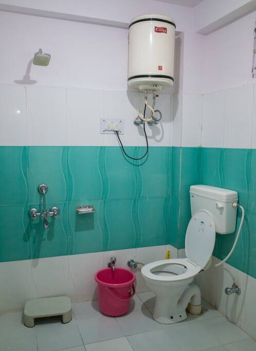 Western style toilet and shower with 24/7 hot water