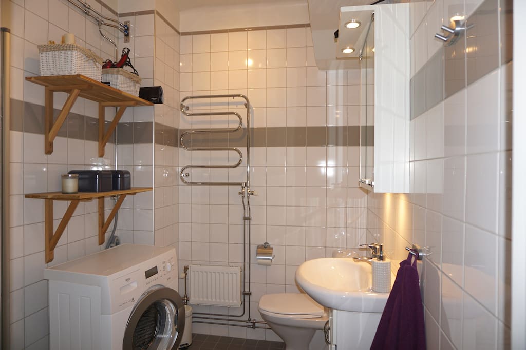 Convenient bathroom with shower.