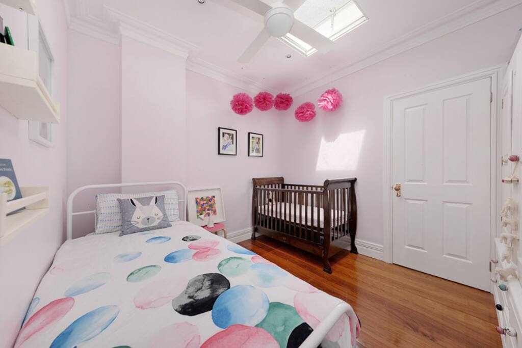 Second bedroom. Two single beds (one trundle) and cot.
