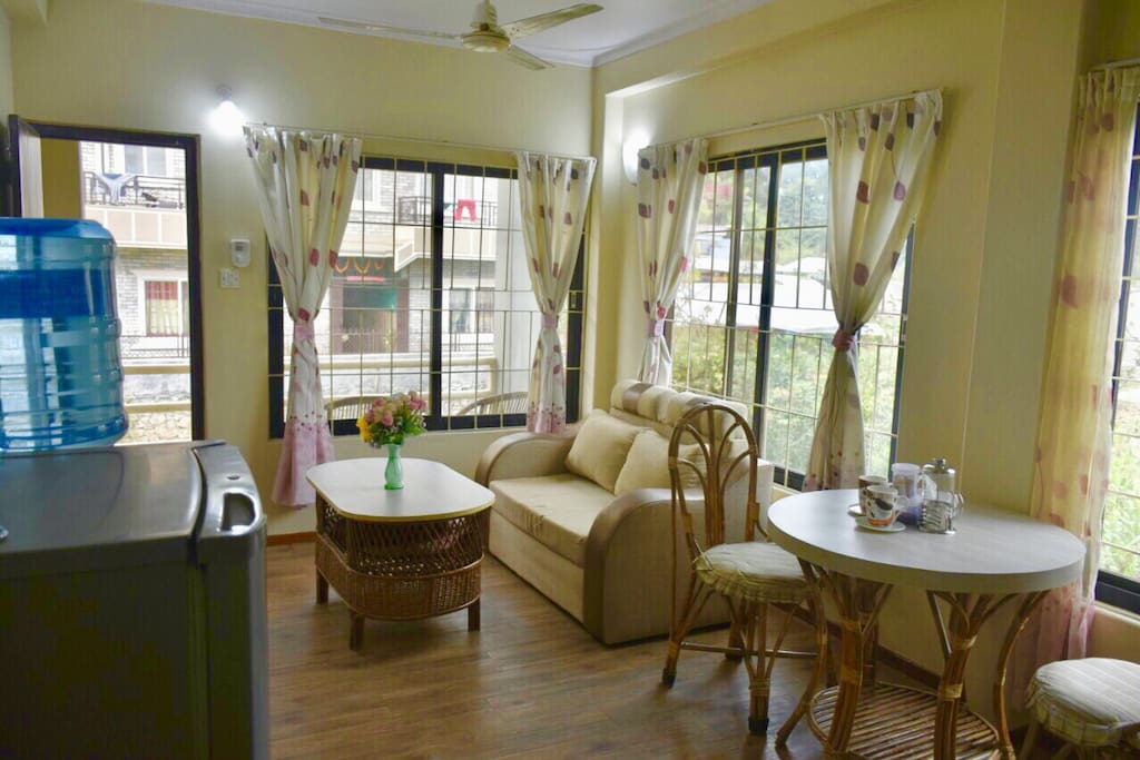 Living and dining area with refrigerator, drinking water dispenser...