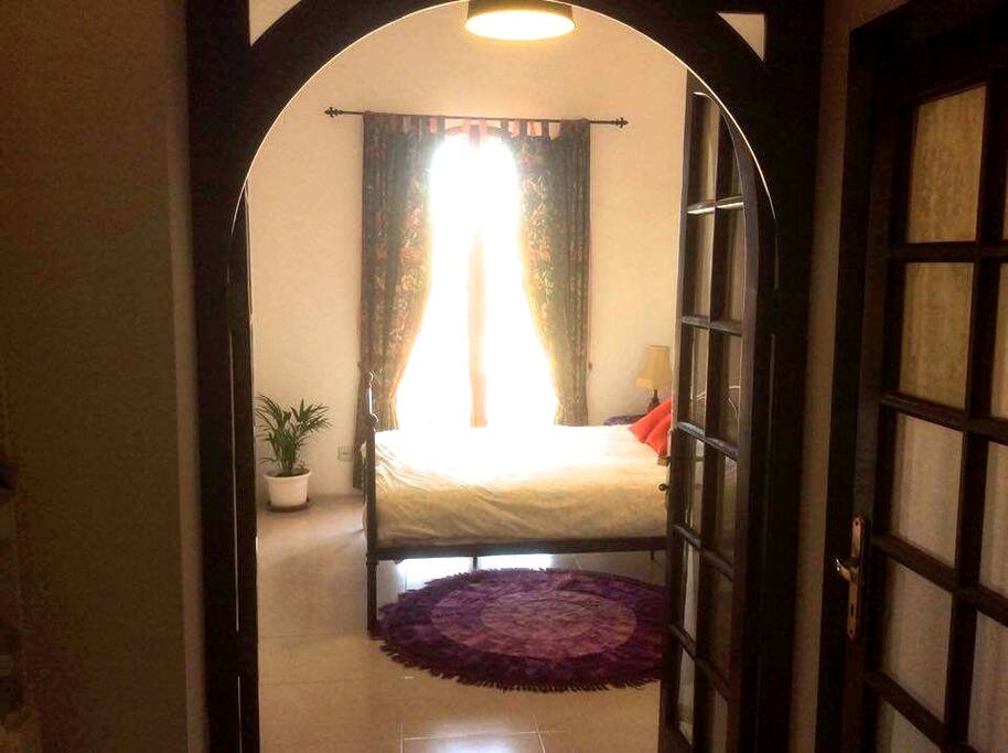 Old Town House Bedroom with double bed, on the right en suite bathroom