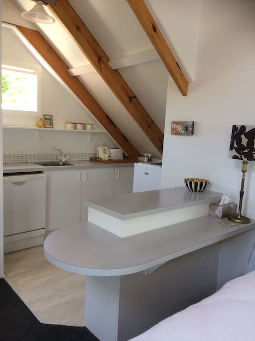 Kitchenette suitable for heat and eat, snacks, small fridge, tea,coffee and toast making facilities. Microwave. Induction job, small bench oven/grill.