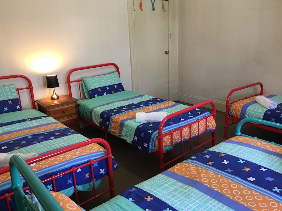 1st room has 4 single beds
