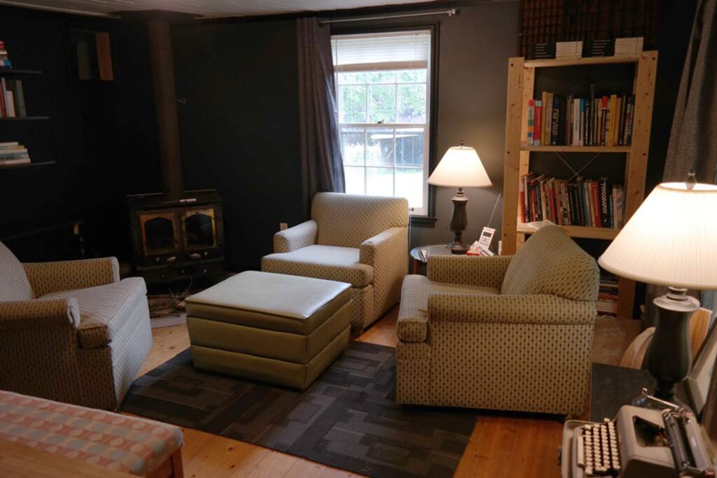 Front common room with woodburning stove.