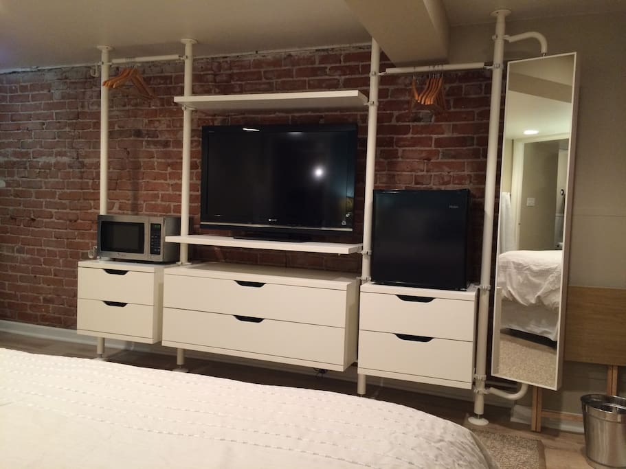 TV, microwave, and small fridge are ready for your use.