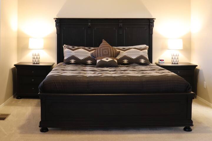 Upstairs, the master bedroom includes a king-size bed with a memory foam mattress.