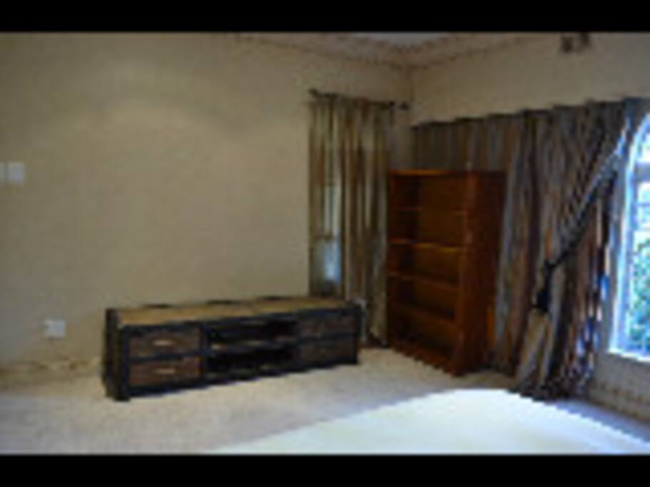 Sophisticated bedroom with shared bathroom, underfloor heating and ceiling fan